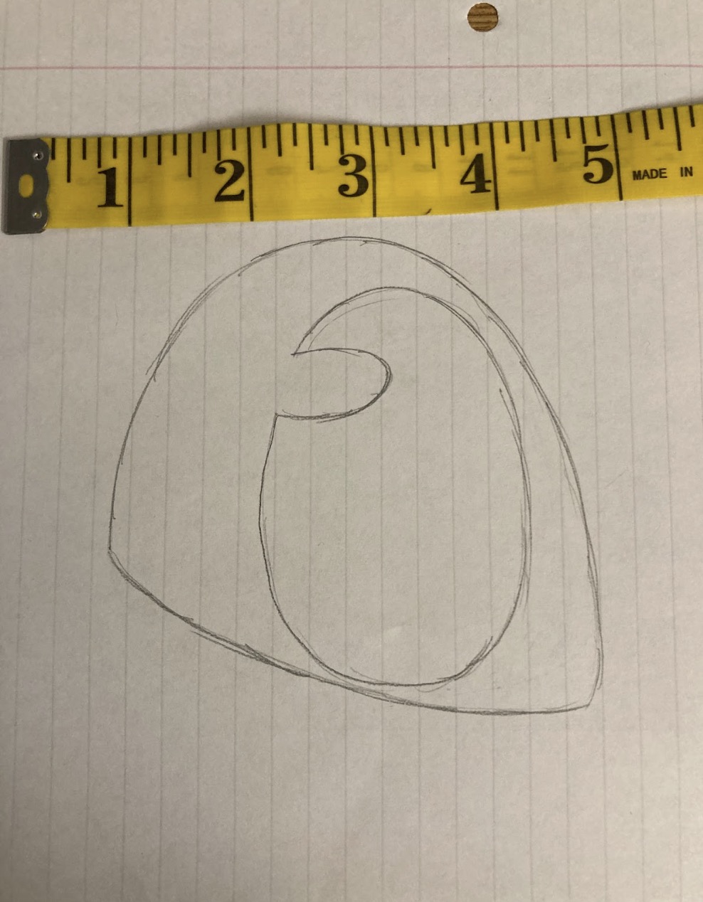 Drawing of a fursuit eye with a measuring tape next to it