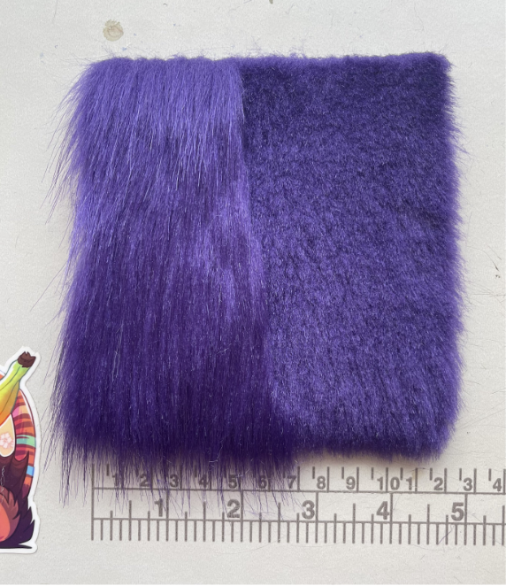 Purple teddy fox from Canfur. Half of the swatch is shaved, the other is at full length.