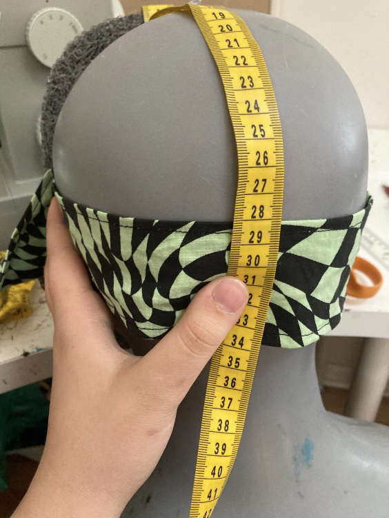 Measuring tape running down to the cotton strap