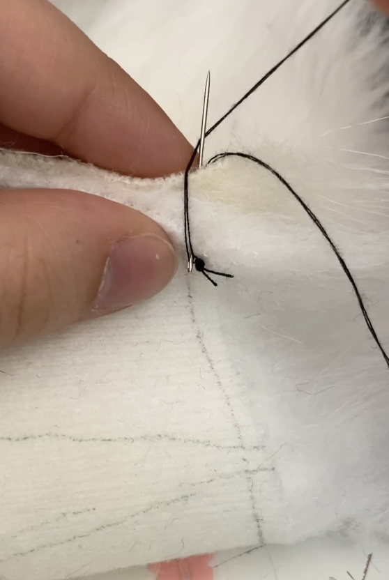 Needle now has thread being wrapped around it