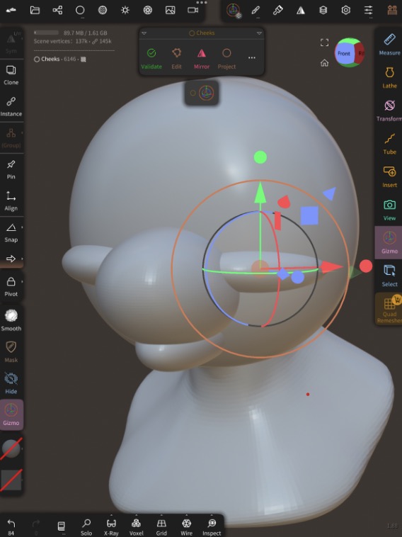 Mirrored elongated spheres added for the cheeks. They don't look like cheeks yet