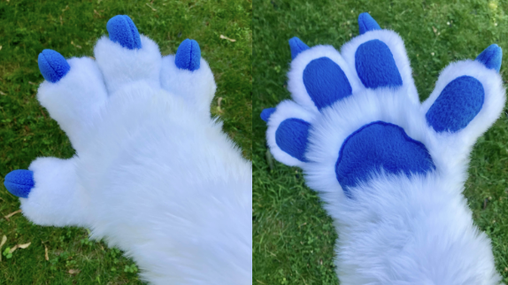 White four-fingered paws with blue paw pads and blue claws